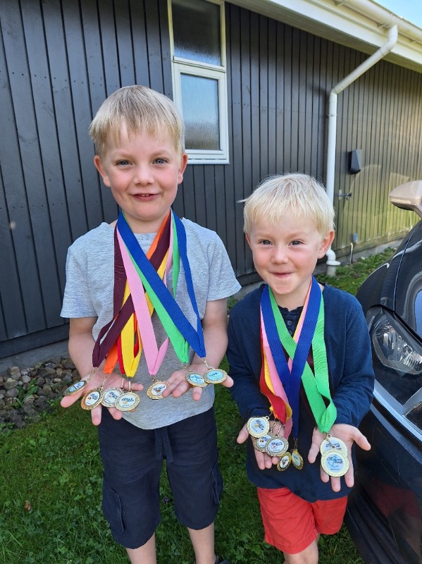 Two very proud boys with their madals